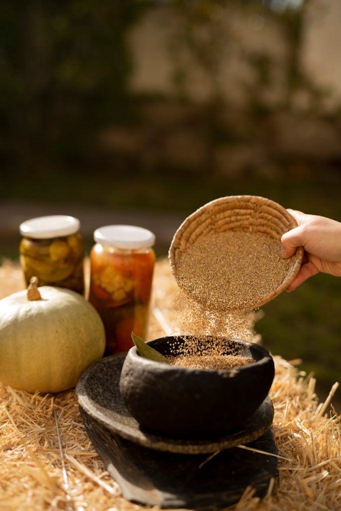 a hand holding a jar of food